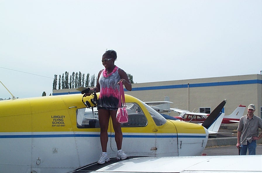 Alexis Jeffery on the wing of Cherokee GODP after the completion of her First Solo Flight on June 23, 2008.  Langley Flying School.